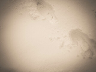 Nature background - shoe footprint in the snow.