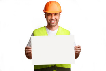 Construction Worker Showing Empty Poster Board Advertising Your Text Posing Standing On White Background In Studio, Smiling To Camera. Professional Builder's Service Advert. Mockup