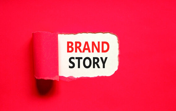 Brand story branding symbol. Concept words Brand story on beautiful white paper. Beautiful red paper background. Business brand story branding concept. Copy space.