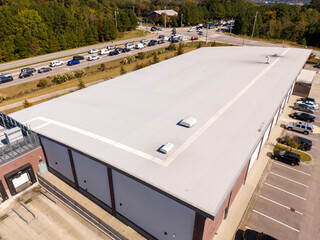 Sunny Daytime Drone Images of a Large Commercial Roof. 