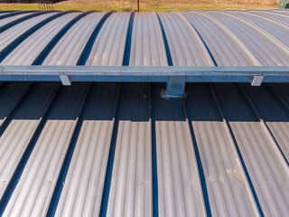 Obraz premium Sunny Daytime Drone Images of New Standing Seam Metal Roof on a Commercial Building