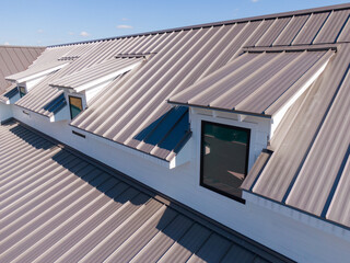 Sunny Daytime Drone Images of New Standing Seam Metal Roof on a Commercial Building © Oak City Drone