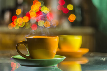 Colored steaming coffee cups
