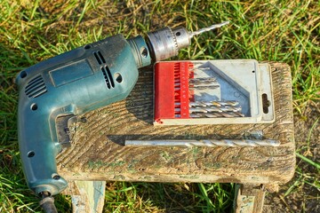 one electric modern powerful plastic industrial green dirty with black cord iron hand drill with...
