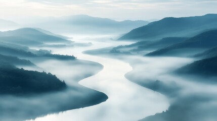 Obraz premium Serene River Winding Through Misty Mountain Valley