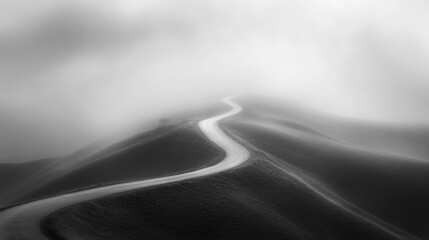 Winding Road Through Foggy Hills