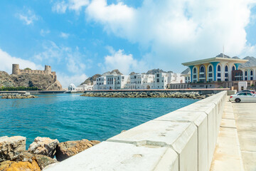 View to the arabian Al Jalali castle standing on the rocks and royal Al Alam ceremonial palace of the Sultan, Muscat, Oman