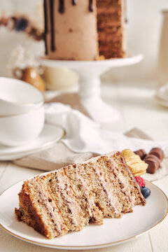 Cake with chocolate drip icing on stand