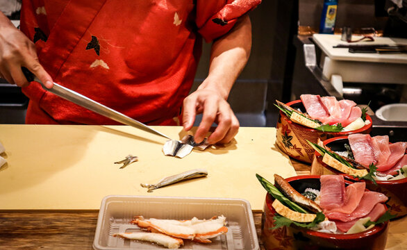 Chef slicing fish