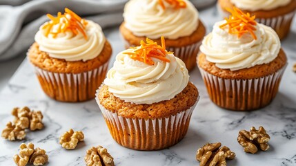Carrot muffins with cream cheese frosting, isolated on a marble countertop, with carrot shavings and walnuts for decoration