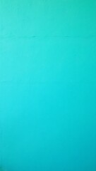 Fototapeta premium Vibrant turquoise stucco wall with textured surface and small cracks for a beachy vibe