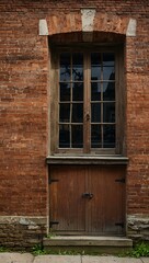 Fototapeta premium Weathered brick building with wooden doors and windows.