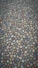 Historic cobblestone street with worn gray and brown stones