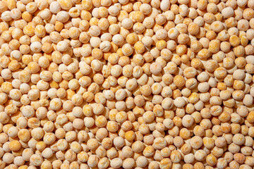 Uncooked Yellow Polished Peas Background. A Culinary Canvas of Dry Yellow Peas, Creating a Lively...