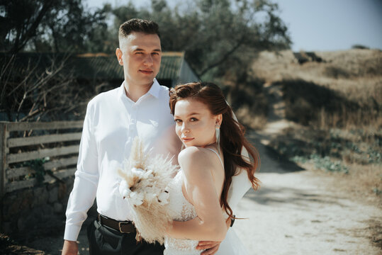 Love story save the date young happy couple in the park outdoors walking