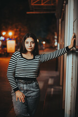 Fashionable Brunette in the Autumn Night City