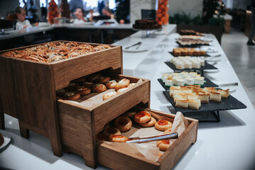 A buffet table with a variety of desserts and pastries