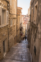 Fototapeta premium Narrow street in the old medieval town of mediterranean country