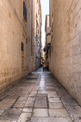 Obraz premium Narrow street in the old medieval town of mediterranean country