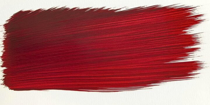 An energetic stroke of red oil paint on a white background. The texture of the paint creates an effect of depth and volume. Ideal for creating bright accents in design.