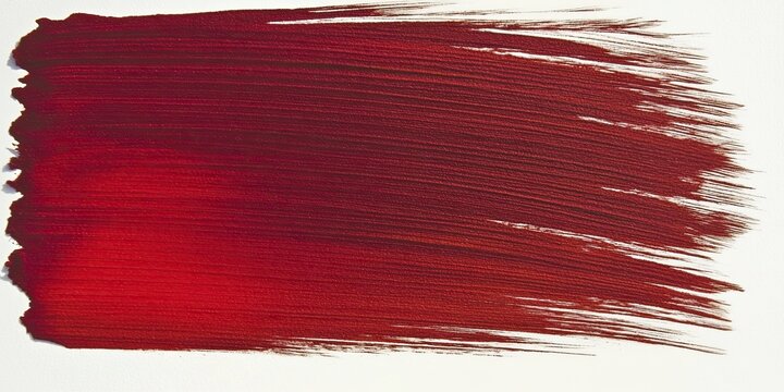 An energetic stroke of red oil paint on a white background. The texture of the paint creates an effect of depth and volume. Ideal for creating bright accents in design.