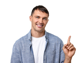 Fototapeta premium Smiling man with dental braces pointing at something on white background