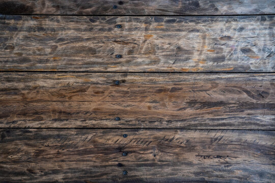 Weathered wood plank with screws backdrop 