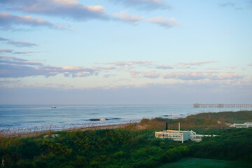 Fototapeta premium sunrise on the beach, cotton candy clouds