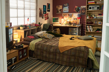 Comfortable study setup in cozy retro bedroom featuring a well-organized desk with various items...