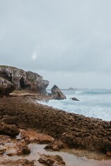 Cliff by the ocean on the beach