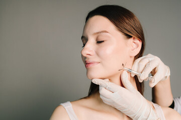 Correction of the jaw with fillers. Contouring of the corners of the jaw. Professional beauty...