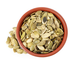 Peeled pumpkin seeds in bowl isolated on white, top view