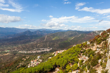 Fototapeta premium Mountain landscape above Baunei town in Eastern Sardinia, with scenic views of the valley.