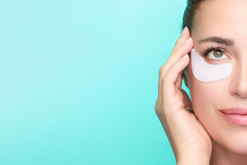 Woman enjoying a skincare routine with eye patches on