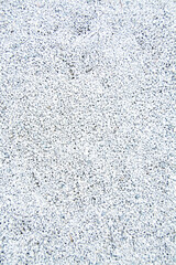 Modern white pebbles decoration. Gravel road. Background of small stones texture.