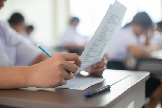 The students were doing the exams inside the classroom with stress.Assessment examination of high school students