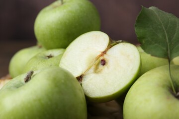 Whole and cut ripe green apples, closeup