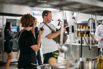 Film set, monitors and modern shooting equipment. Film crew, lighting devices, monitors, playbacks - filming equipment and a team of specialists in filming movies, advertising and TV series