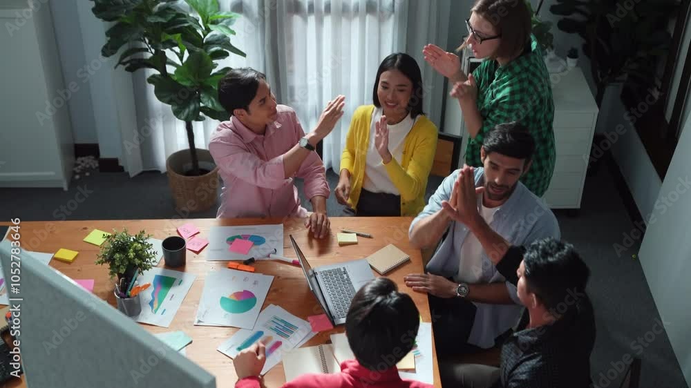 Poster top view of creative team giving high five to celebrate increasing sales or successful idea. group o