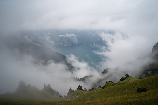 Misty landscape overlooking a lake in Stoos, Switzerland
