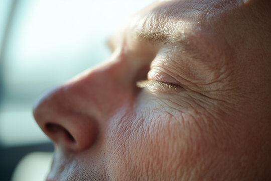 Close-up of an elderly man relaxing with eyes closed