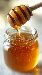 Delicious Golden Honey Dripping from Wooden Dipper into Glass Jar, Natural Sweetener, Healthy Organic Honeycomb Nectar for Wellness, Baking, Cooking, Tea