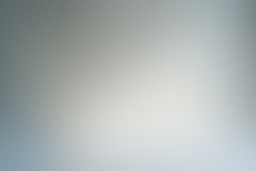 Abstract noisy grainy background with a soft gradient, creating a textured backdrop for creative projects