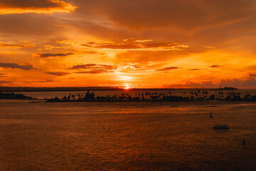 A Stunning Sunset Over A Tropical Island Near El Morro, San Juan, Puerto Rico, With Silhouetted...
