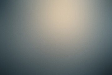 A blurry gray background with a yellow spot in the middle. Noisy background with grain