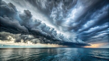 Fototapeta premium Storm clouds looming over a dark and turbulent sea, storm, clouds, grey, overcast, weather, menacing, dramatic, atmosphere, ocean