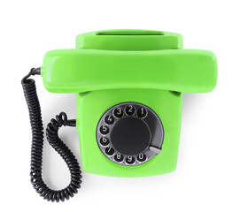 Old light green telephone with rotary dial isolated on white, top view