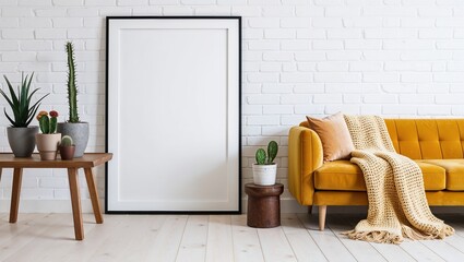 A large, rectangular frames with white backgrounds is propped against a white brick wall, reflecting the simplicity of the room. 