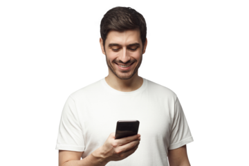 Young man holding phone in one hand and smiling happily while looking at screen