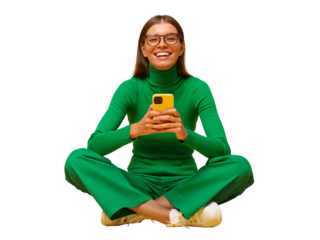 Laughing woman sitting on floor browsing social media posts on phone